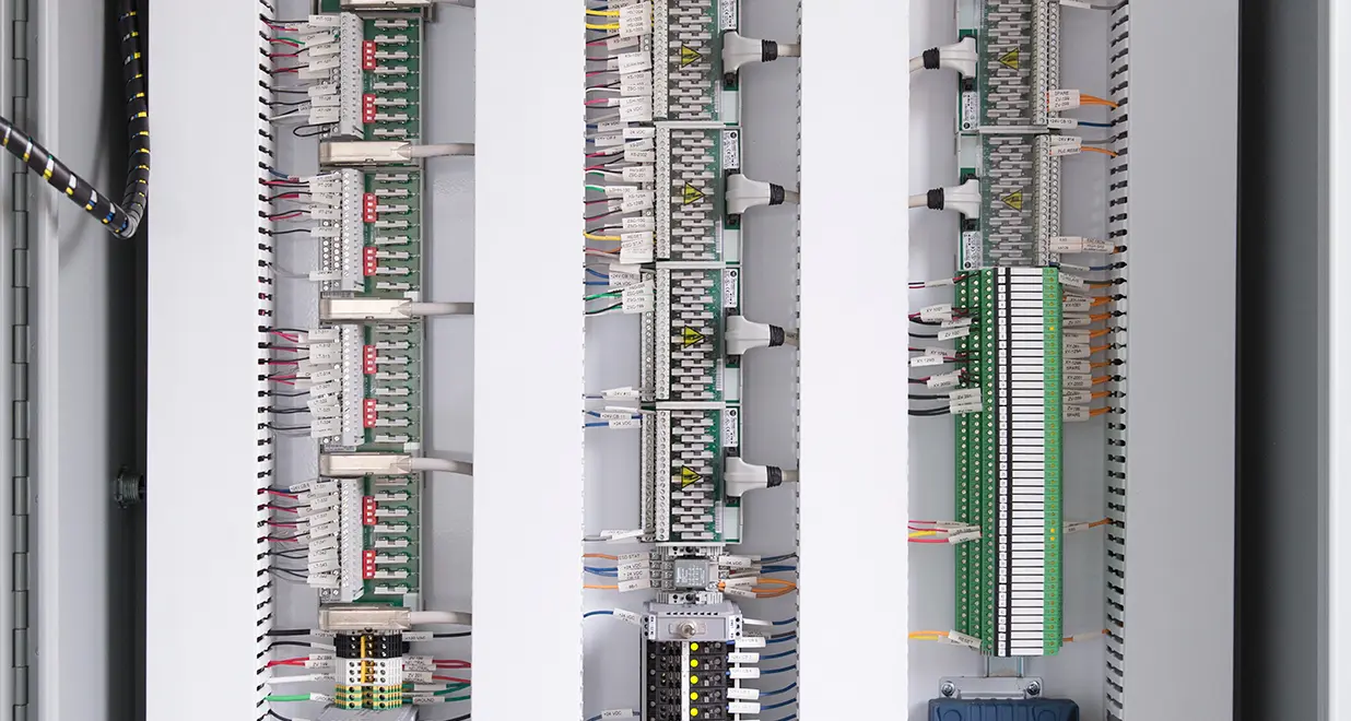 A series of electrical panels with different types of wires.